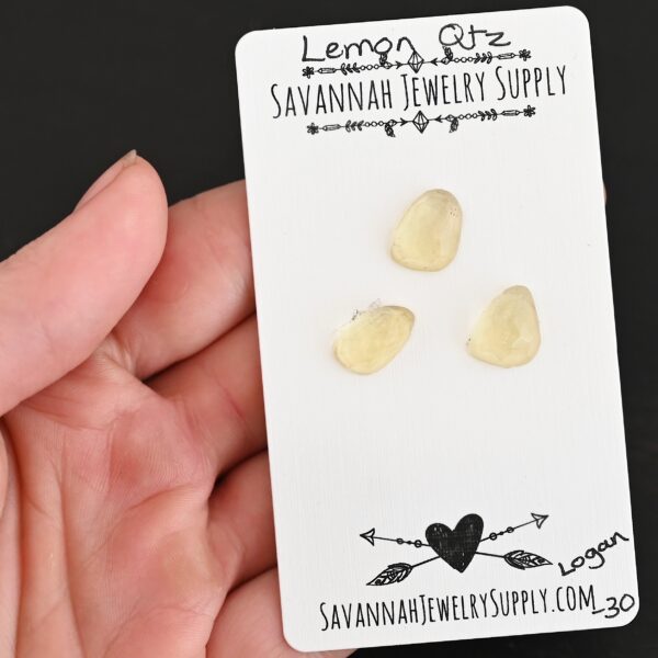 Logan Rose Cut Lemon Quartz Cabochon Parcel shown in hand