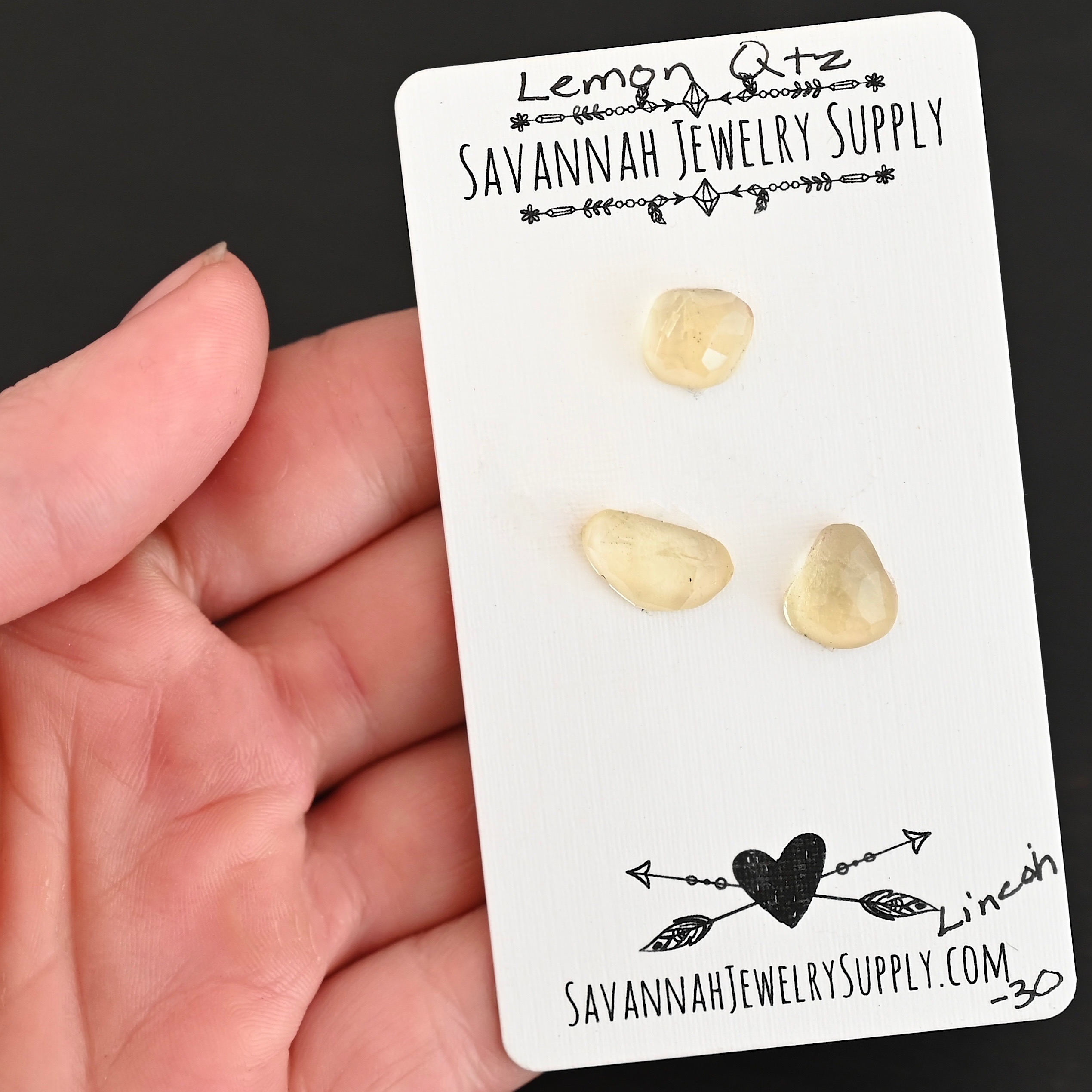 Lincoln Rose Cut Lemon Quartz Cabochon Parcel shown in hand