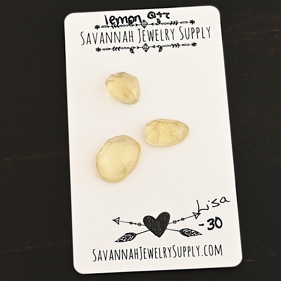Lisa Rose Cut Lemon Quartz Cabochon Parcel shown on business card