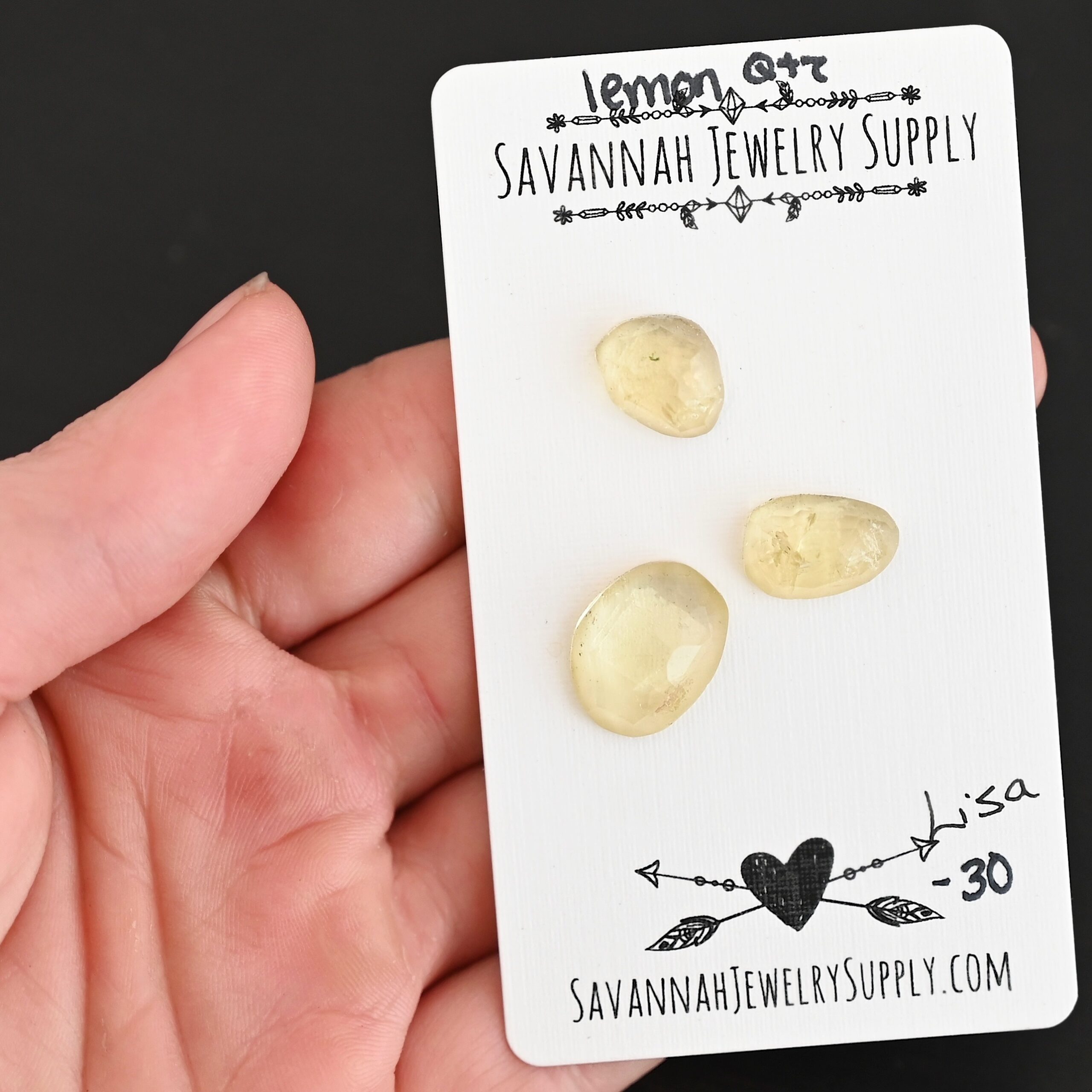 Lisa Rose Cut Lemon Quartz Cabochon Parcel shown in hand