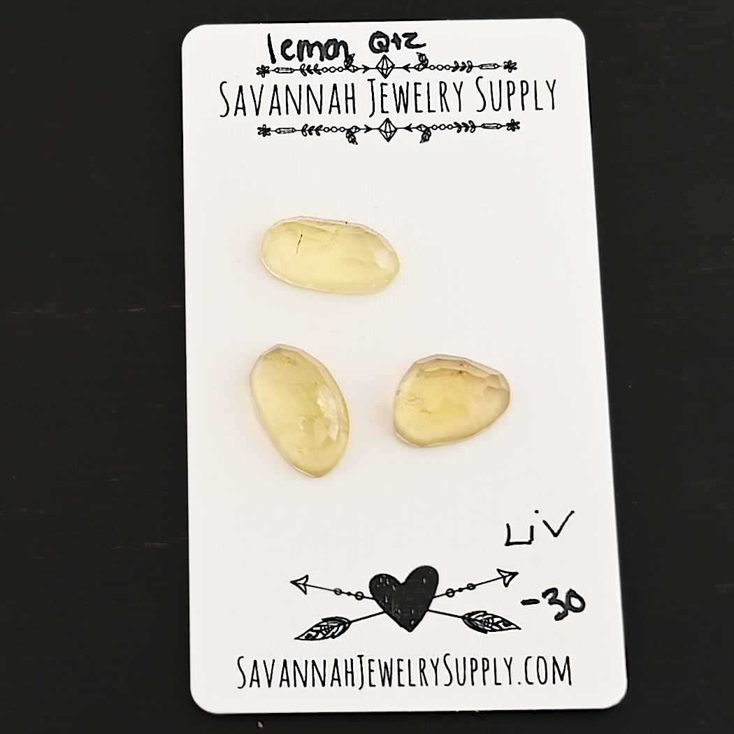Liv Rose Cut Lemon Quartz Cabochon Parcel shown on business card