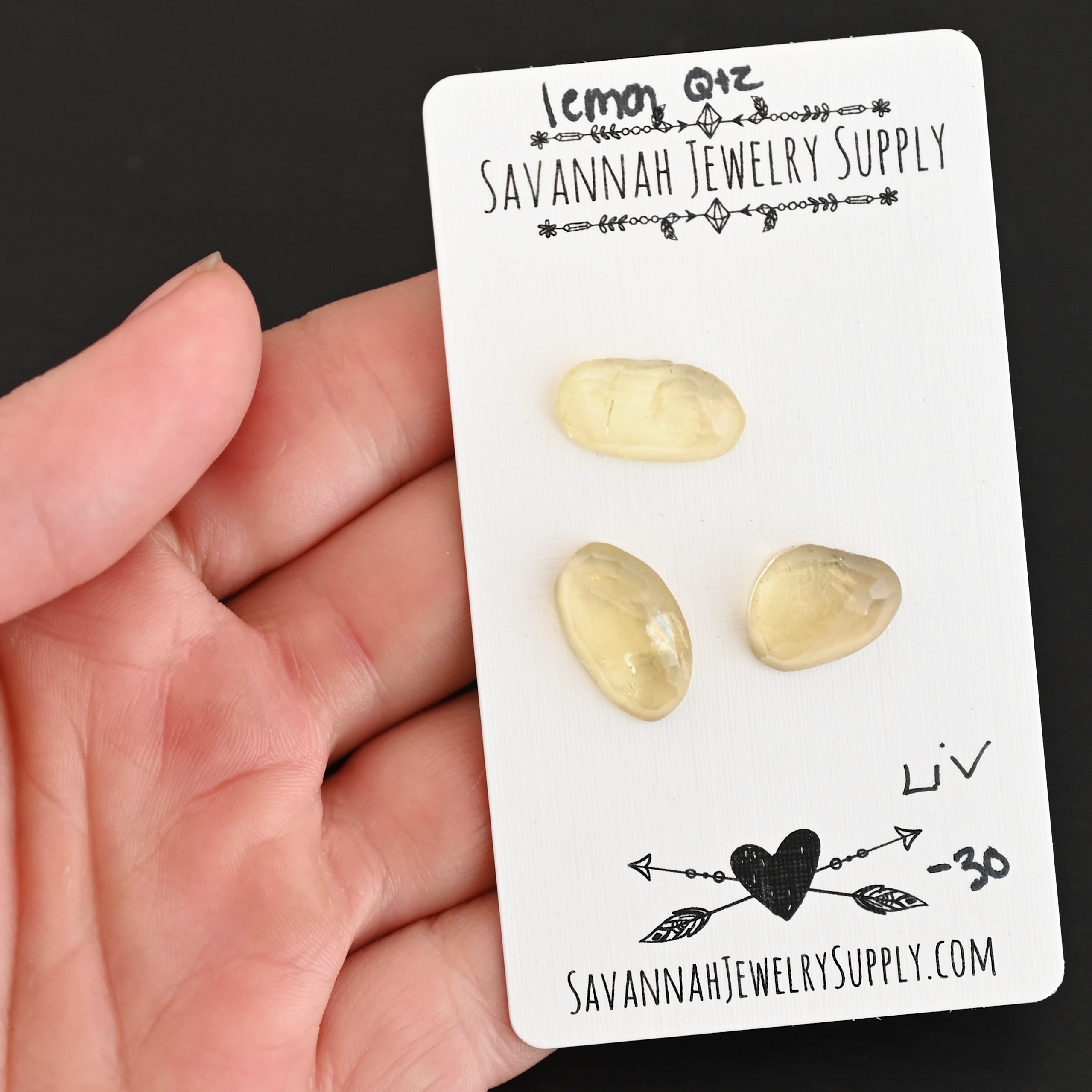 Liv Rose Cut Lemon Quartz Cabochon Parcel shown in hand