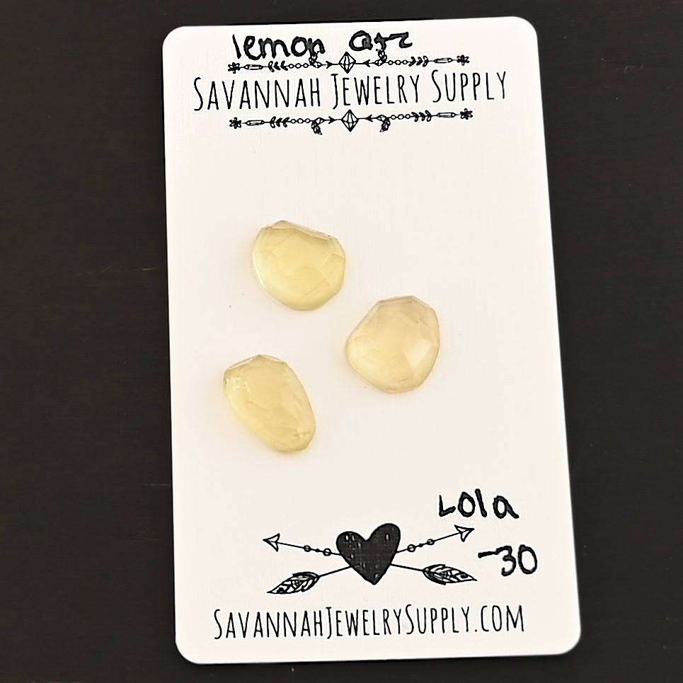 Lola Rose Cut Lemon Quartz Cabochon Parcel shown on business card