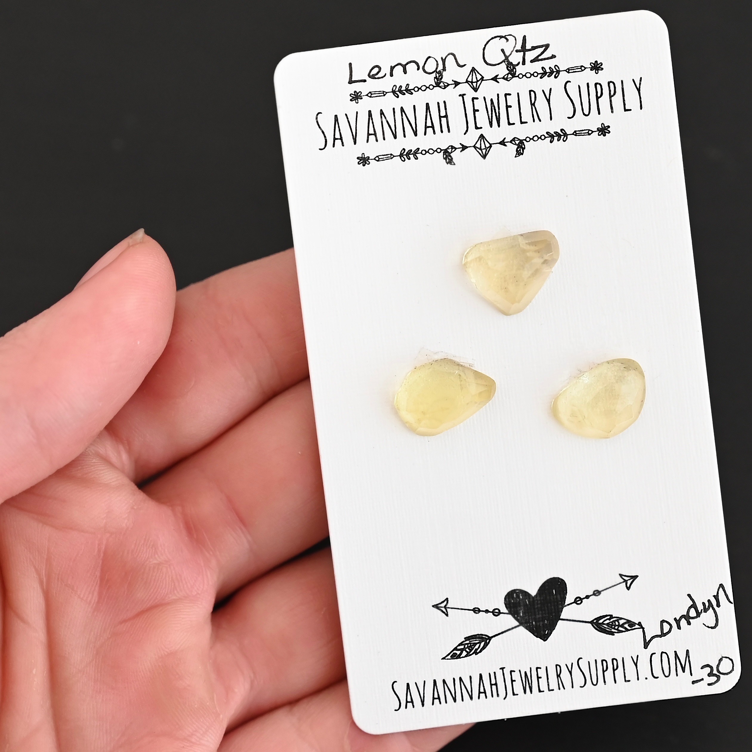 Londyn Rose Cut Lemon Quartz Cabochon Parcel shown in hand