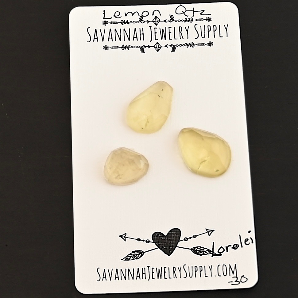 Lorelei Rose Cut Lemon Quartz Cabochon Parcel shown on business card