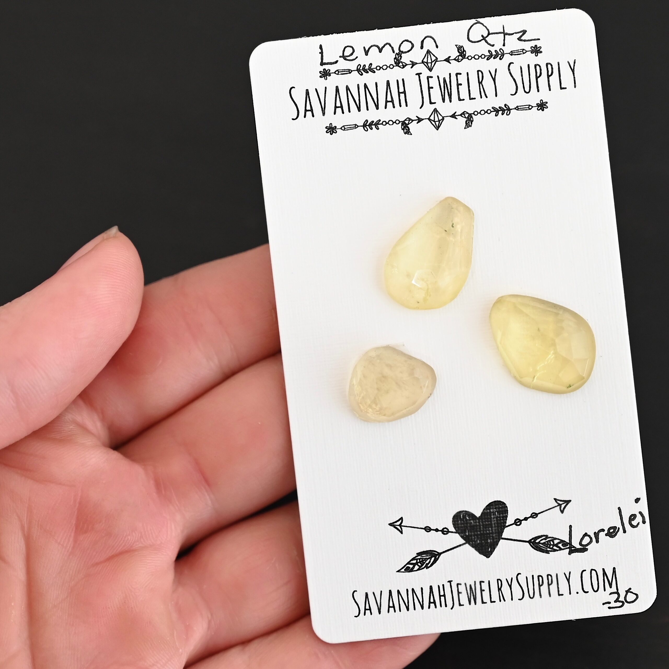 Lorelei Rose Cut Lemon Quartz Cabochon Parcel shown in hand