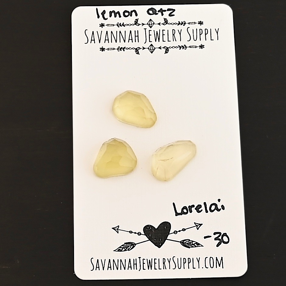 Lorelai Rose Cut Lemon Quartz Cabochon Parcel shown on business card