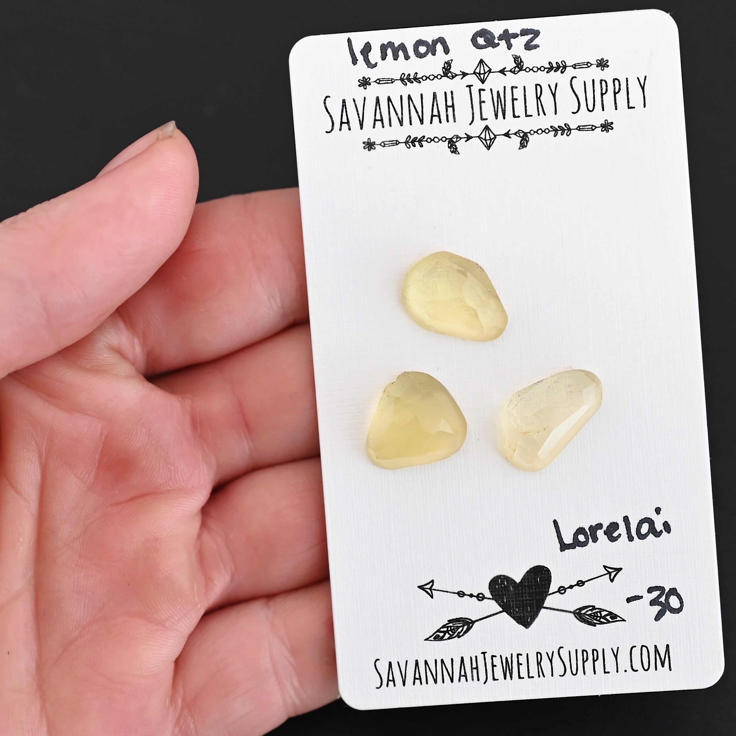 Lorelai Rose Cut Lemon Quartz Cabochon Parcel shown in hand