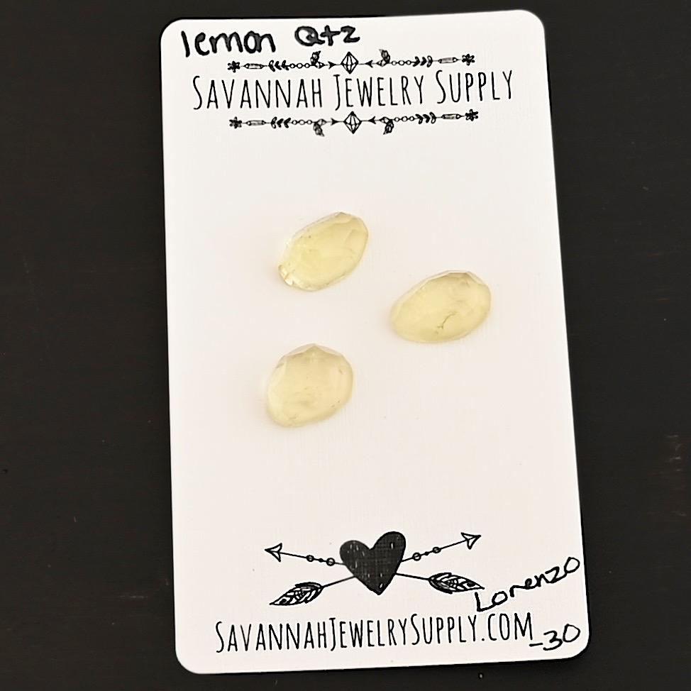 Lorenzo Rose Cut Lemon Quartz Cabochon Parcel shown on business card