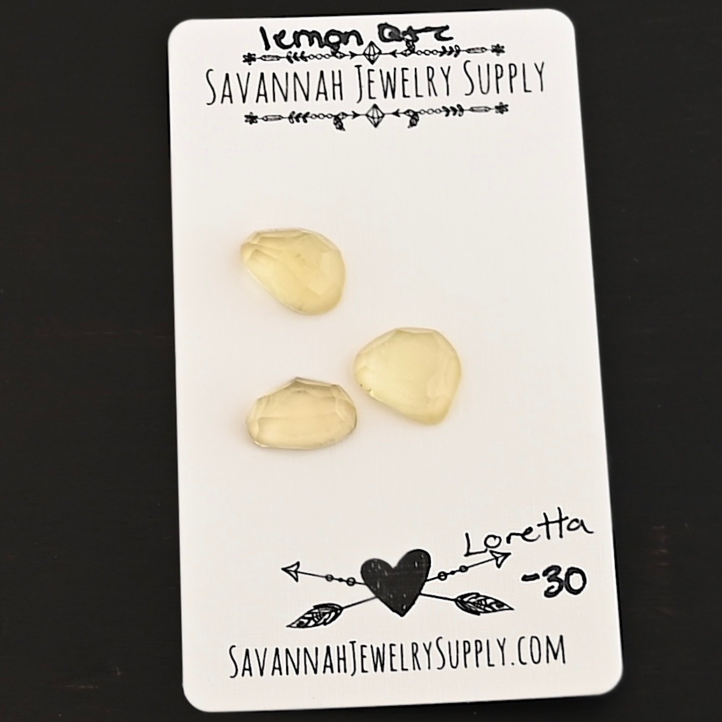 Loretta Rose Cut Lemon Quartz Cabochon Parcel shown on business card