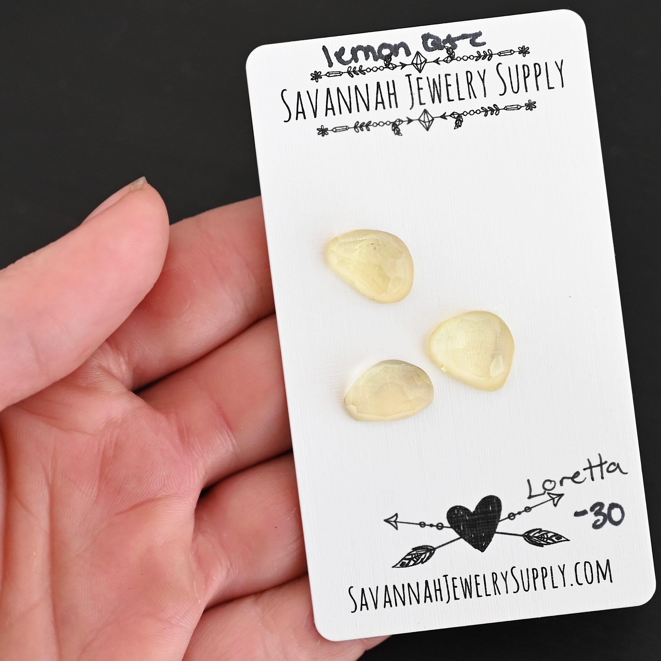 Loretta Rose Cut Lemon Quartz Cabochon Parcel shown in hand