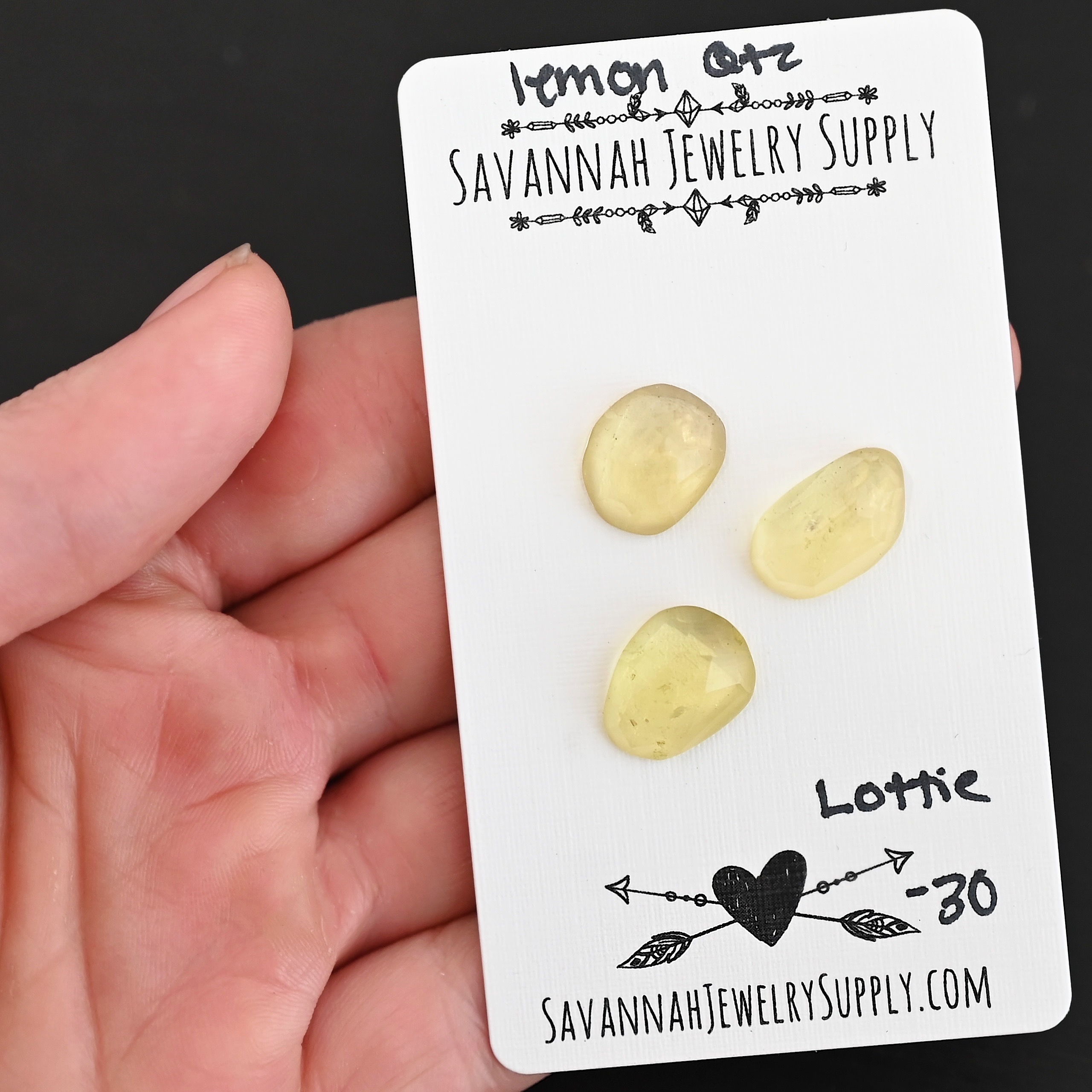 Lottie Rose Cut Lemon Quartz Cabochon Parcel shown in hand