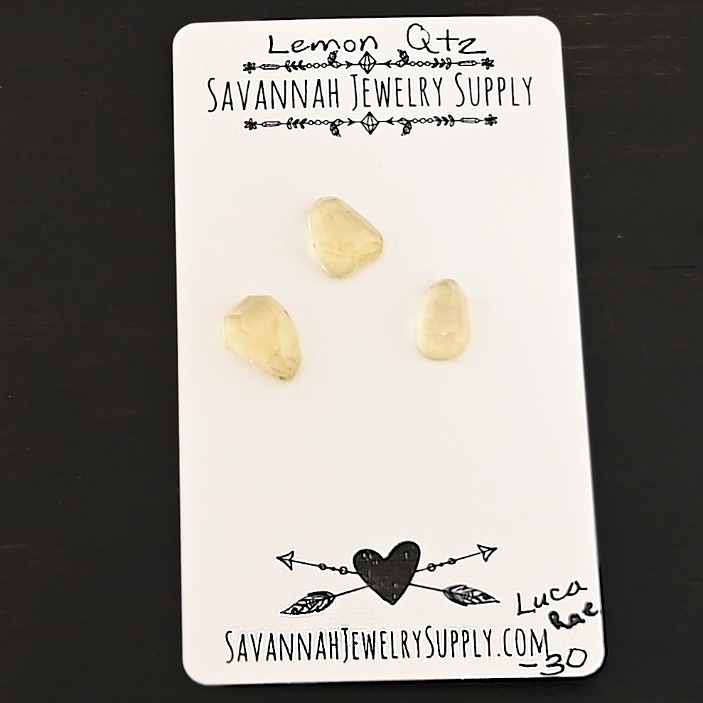 Luca Rae Rose Cut Lemon Quartz Cabochon Parcel shown on business card
