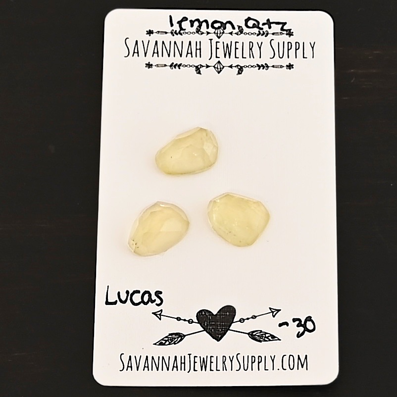 Lucas Rose Cut Lemon Quartz Cabochon Parcel shown on business card