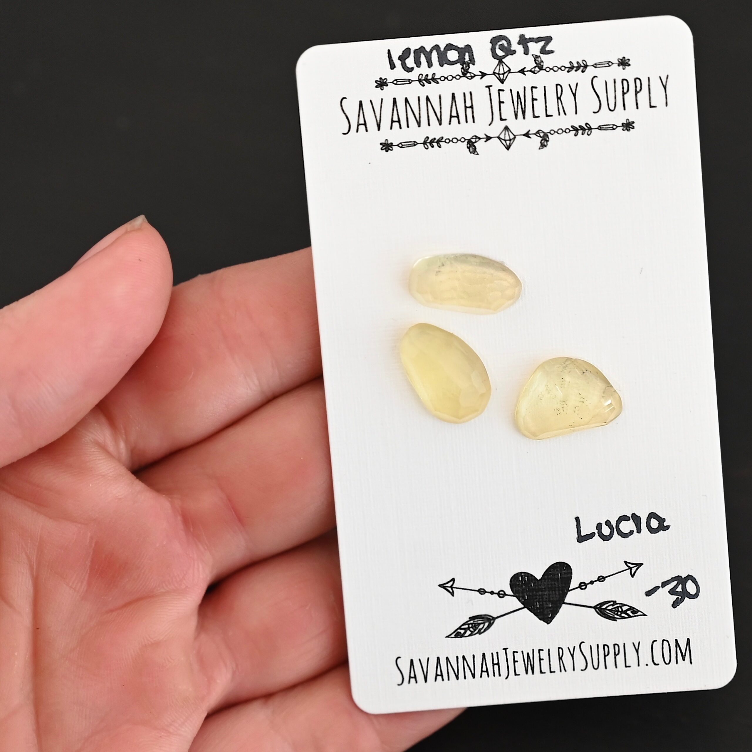 Lucia Rose Cut Lemon Quartz Cabochon Parcel shown in hand