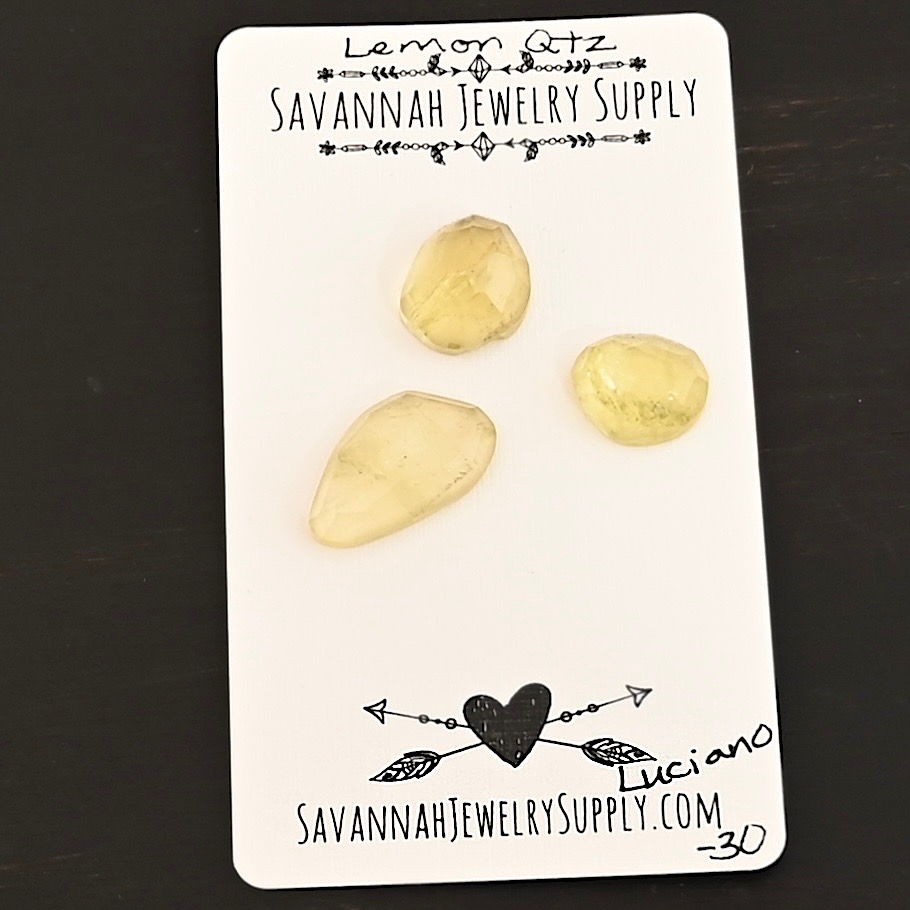 Luciano Rose Cut Lemon Quartz Cabochon Parcel shown on business card