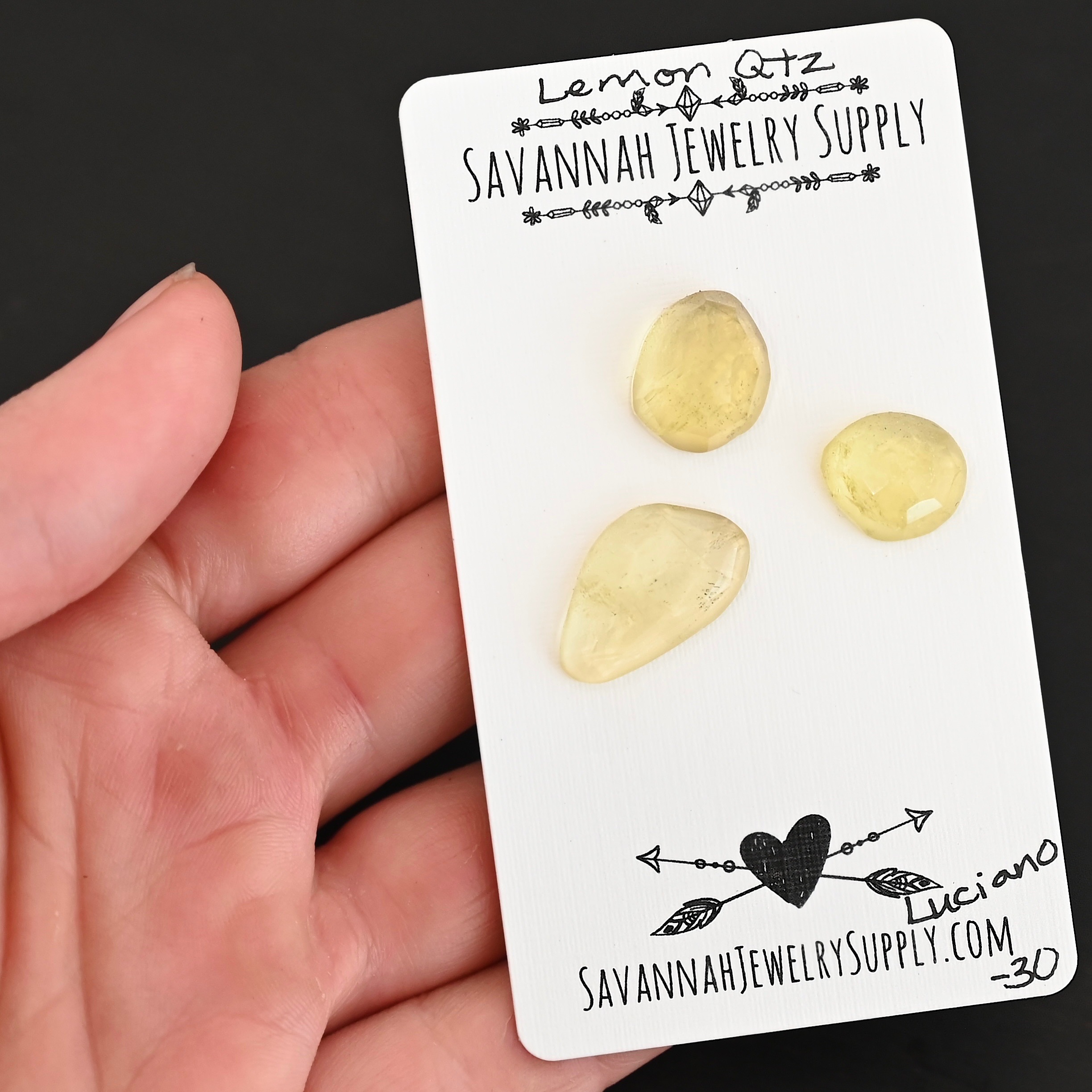 Luciano Rose Cut Lemon Quartz Cabochon Parcel shown in hand