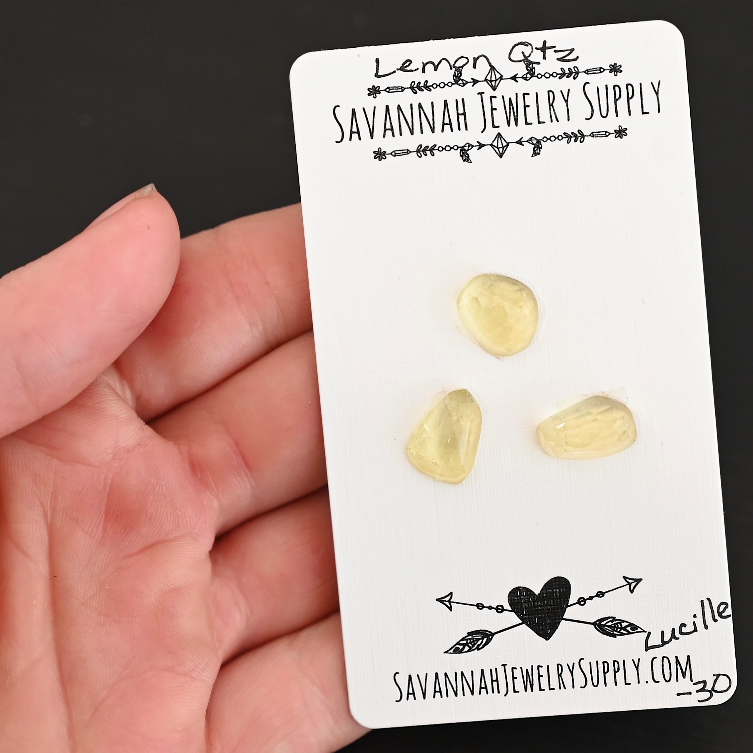 Lucille Rose Cut Lemon Quartz Cabochon Parcel shown in hand