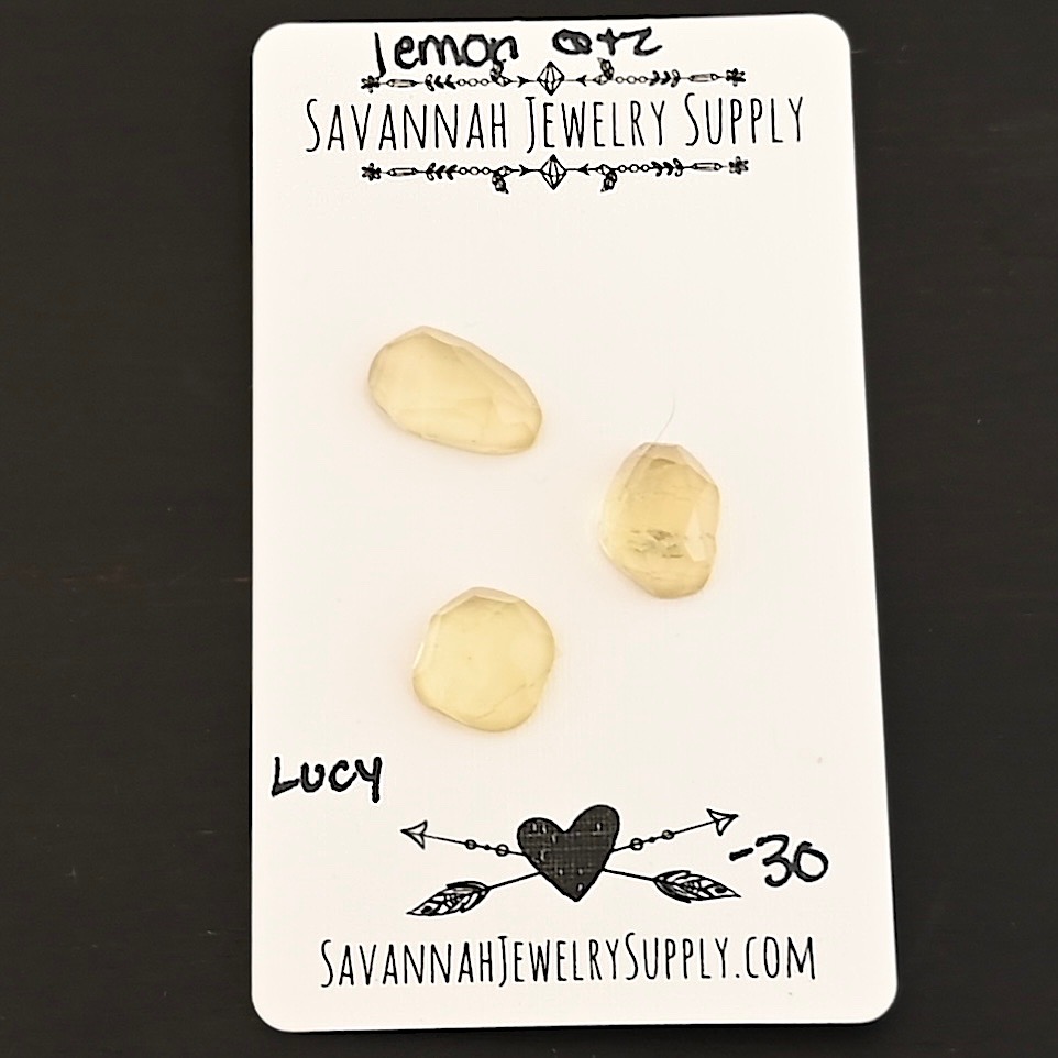 Lucy Rose Cut Lemon Quartz Cabochon Parcel shown on business card