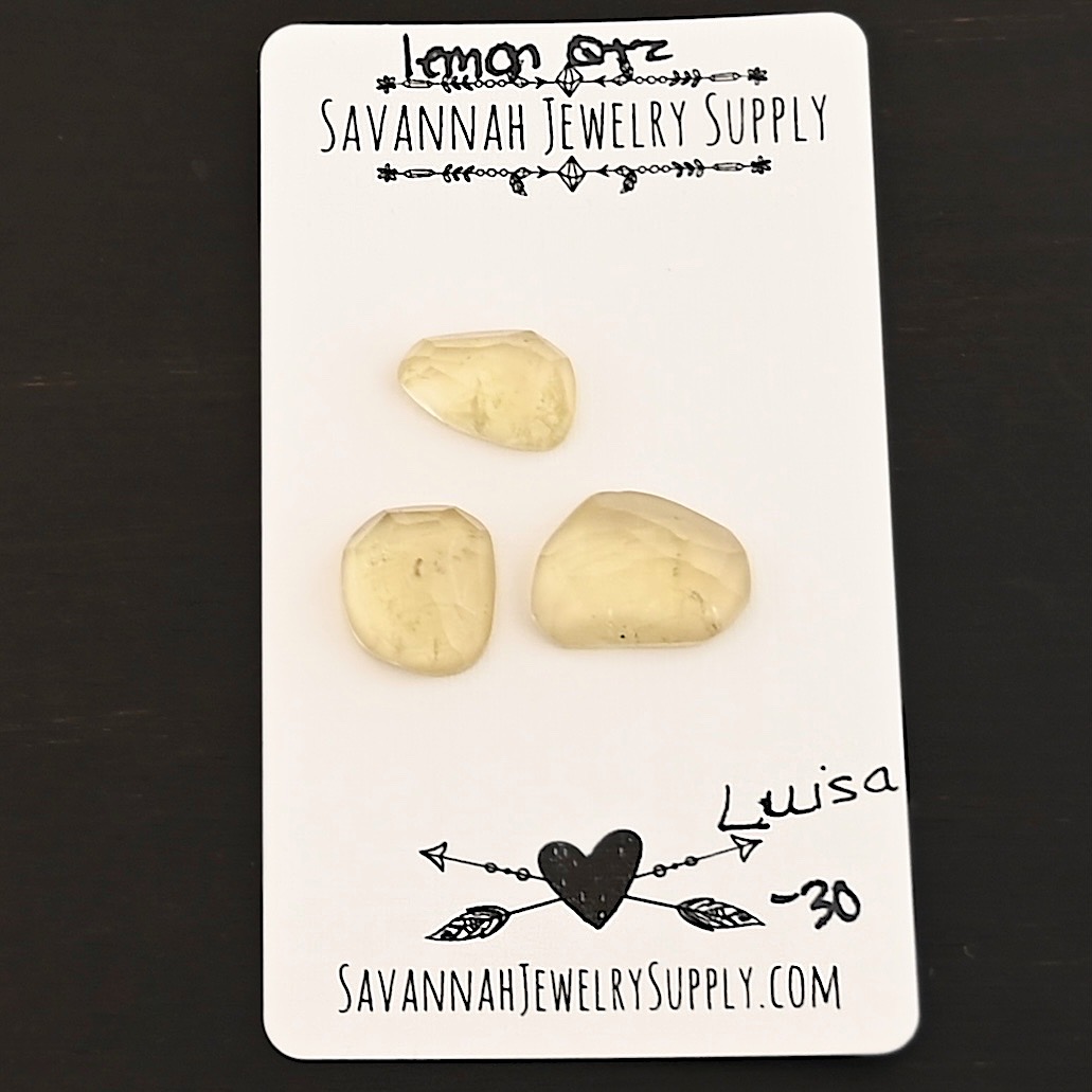 Luisa Rose Cut Lemon Quartz Cabochon Parcel shown on business card