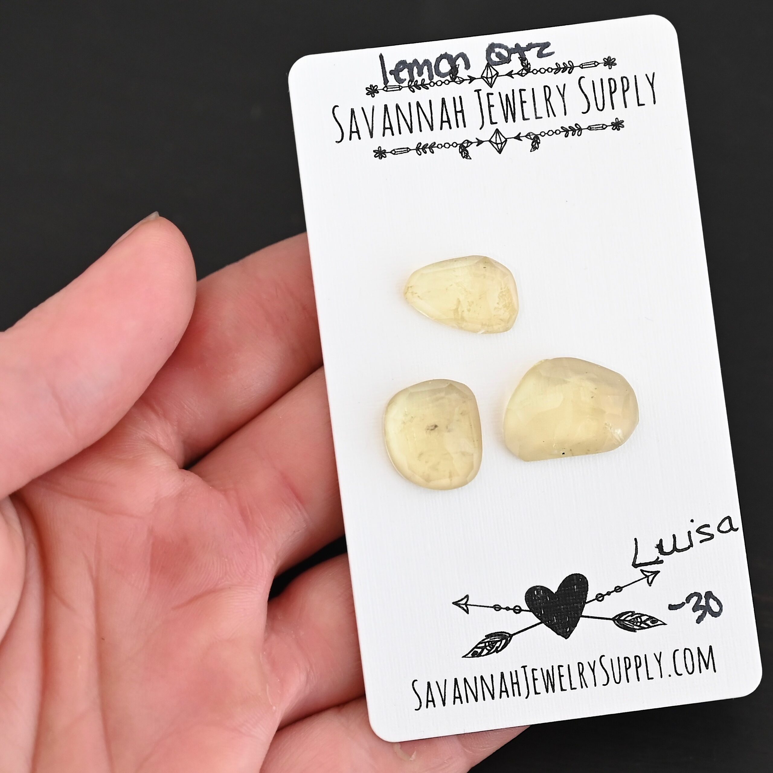 Luisa Rose Cut Lemon Quartz Cabochon Parcel shown in hand