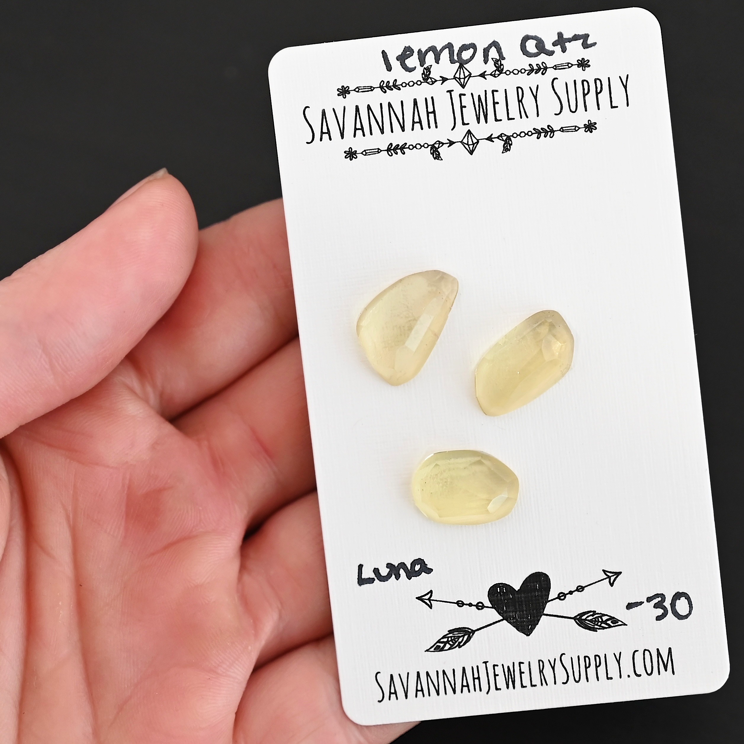 Luna Rose Cut Lemon Quartz Cabochon Parcel shown in hand