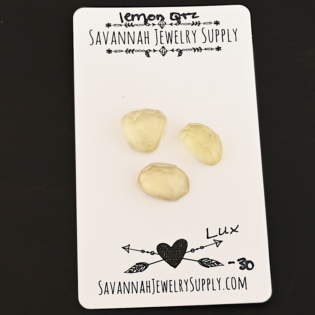 Lux Rose Cut Lemon Quartz Cabochon Parcel shown on business card