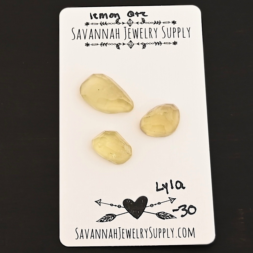 Lyla Rose Cut Lemon Quartz Cabochon Parcel shown on business card