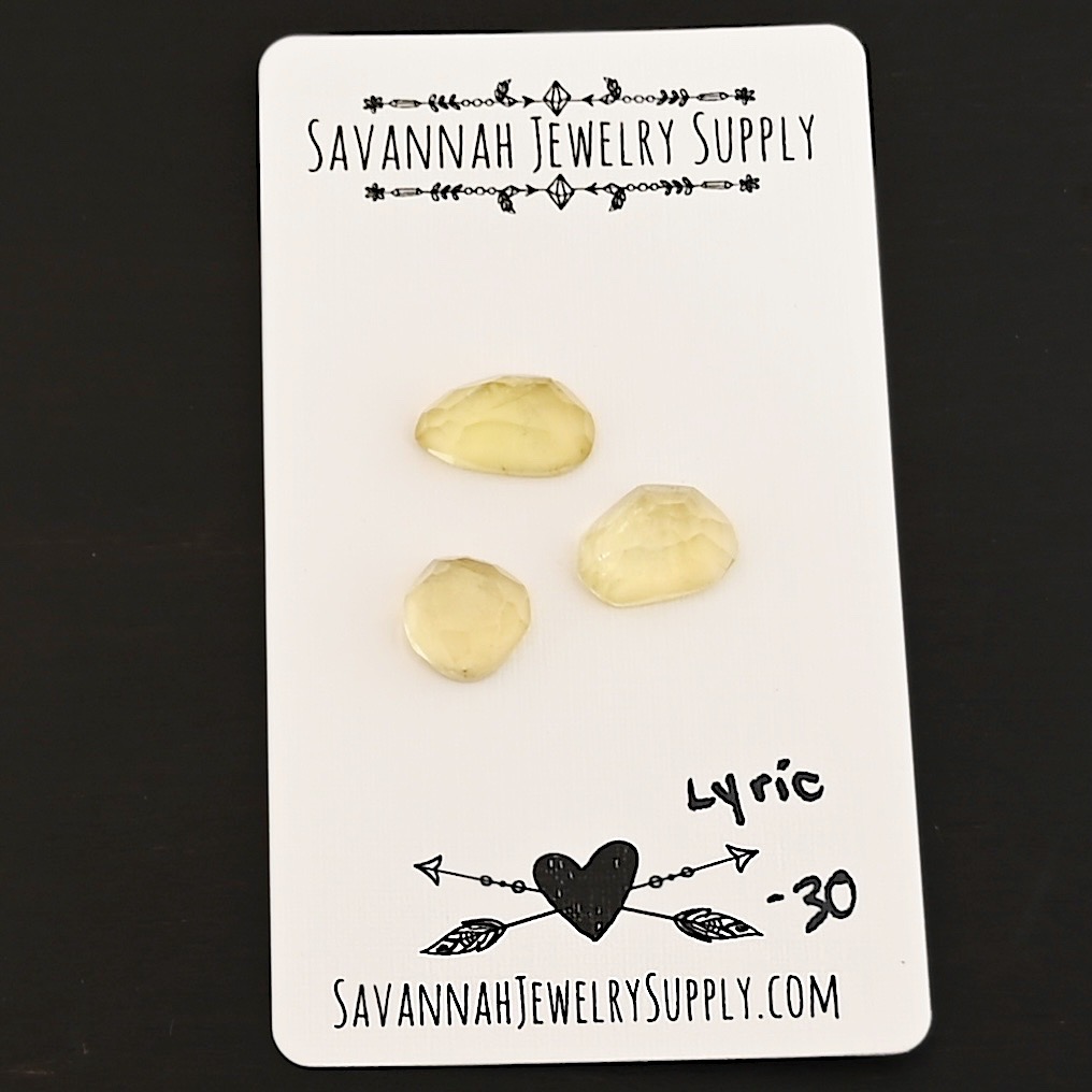 Lyric Rose Cut Lemon Quartz Cabochon Parcel shown on business card